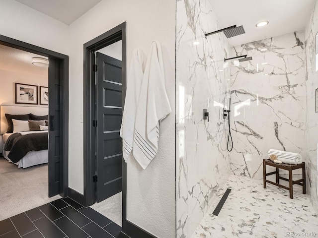 ensuite bathroom with a marble finish shower and connected bathroom