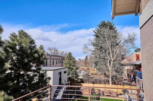 view of yard with a balcony