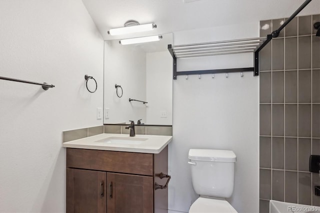 full bath with toilet and vanity