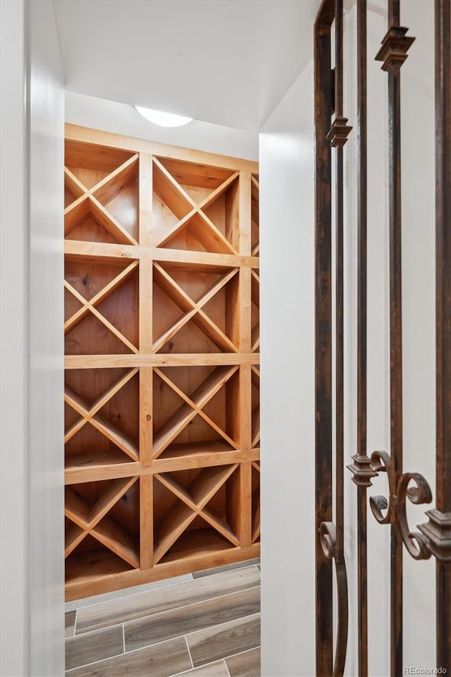 wine cellar featuring wood tiled floor