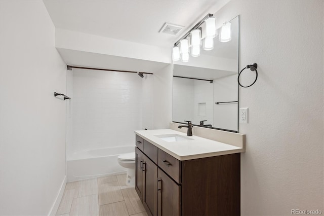 full bathroom featuring toilet, shower / bathing tub combination, visible vents, and vanity