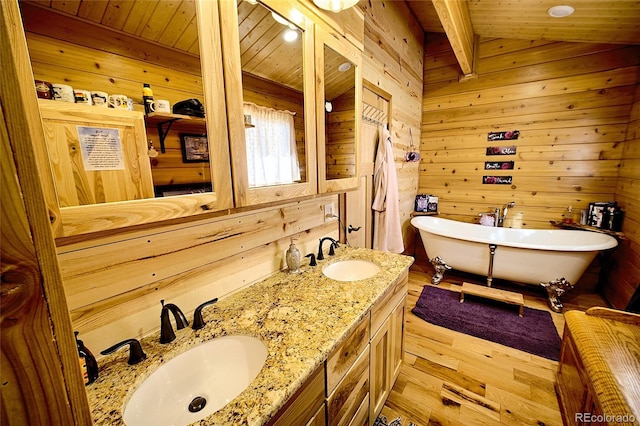 bathroom featuring wood walls, wooden ceiling, vaulted ceiling, wood-type flooring, and a tub