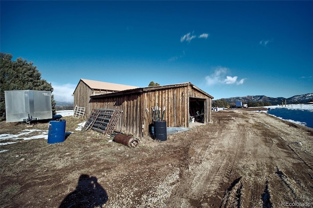 view of outbuilding featuring a mountain view