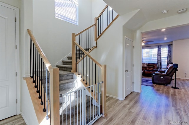 9448 Richfield St, Commerce City, CO 80022 - stairs with healthy amount of natural light, wood finished floors, ceiling fan, and baseboards