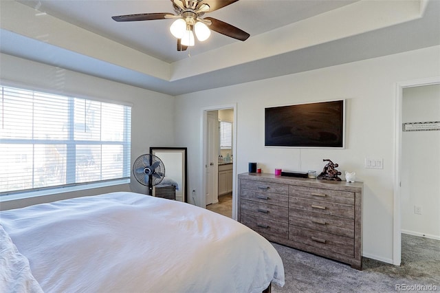 9448 Richfield St, Commerce City, CO 80022 - bedroom with light carpet, baseboards, a ceiling fan, and a tray ceiling