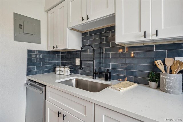 3855 S Monaco St Unit 182, Denver, CO 80237 - kitchen with electric panel, dishwasher, white cabinetry, and tasteful backsplash