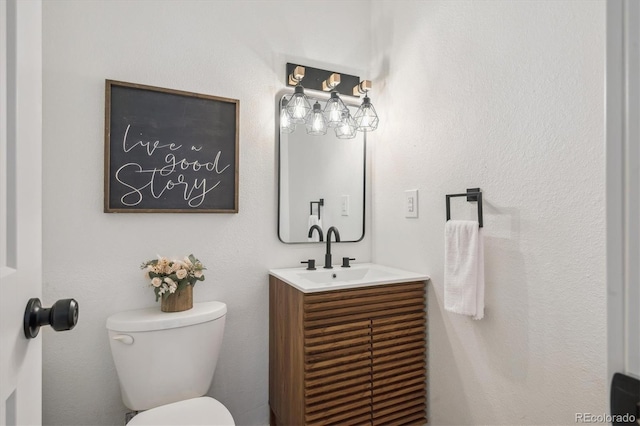 3855 S Monaco St Unit 182, Denver, CO 80237 - half bath featuring vanity and toilet