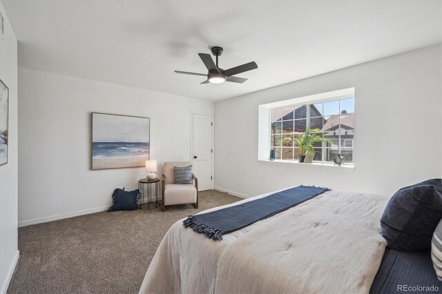 3855 S Monaco St Unit 182, Denver, CO 80237 - bedroom featuring carpet floors, baseboards, and a ceiling fan