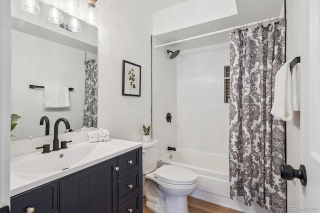 3855 S Monaco St Unit 182, Denver, CO 80237 - full bathroom featuring toilet, shower / bath combo with shower curtain, and vanity