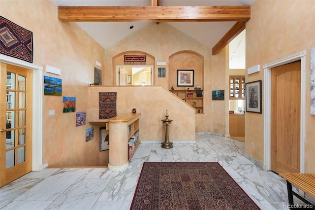 1426 Rembrandt Rd, Boulder, CO 80302 - entrance foyer with high vaulted ceiling, beamed ceiling, marble finish floors, and baseboards