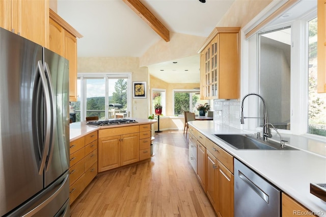 1426 Rembrandt Rd, Boulder, CO 80302 - kitchen featuring appliances with stainless steel finishes, a sink, light wood-style floors, light countertops, and plenty of natural light