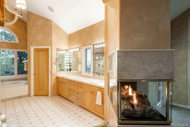 1426 Rembrandt Rd, Boulder, CO 80302 - full bath featuring high vaulted ceiling, a bath, double vanity, and tile patterned floors
