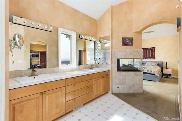 1426 Rembrandt Rd, Boulder, CO 80302 - ensuite bathroom with a high ceiling, tile patterned floors, and double vanity