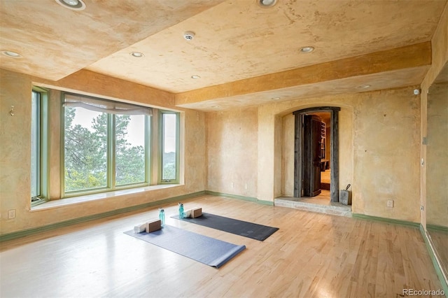 1426 Rembrandt Rd, Boulder, CO 80302 - workout area featuring arched walkways, light wood-style flooring, baseboards, and recessed lighting