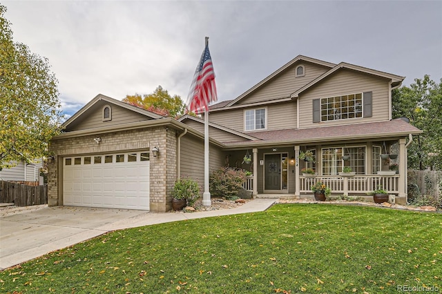 view of front of house featuring a front lawn, covered porch, and a garage