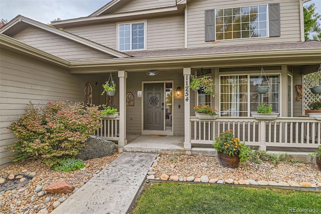 property entrance featuring a porch