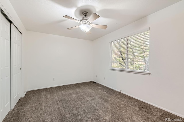 unfurnished bedroom with carpet flooring, a closet, and ceiling fan