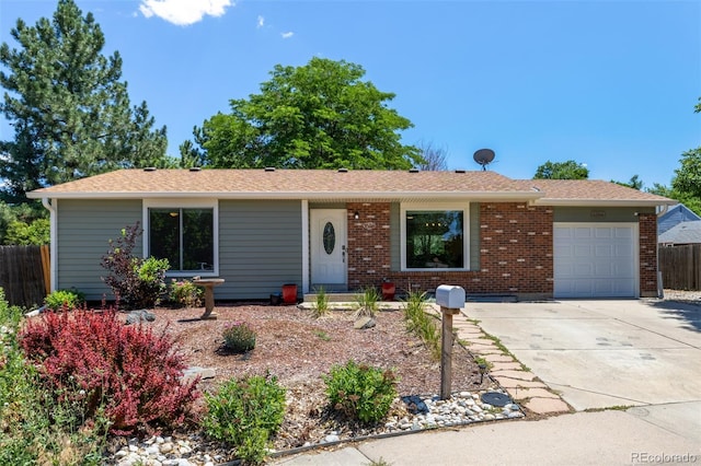 1394 S Zeno St, Aurora, CO 80017 - single story home featuring a garage, concrete driveway, and brick siding