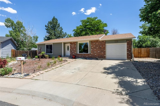 1394 S Zeno St, Aurora, CO 80017 - ranch-style house with brick siding, concrete driveway, and a garage
