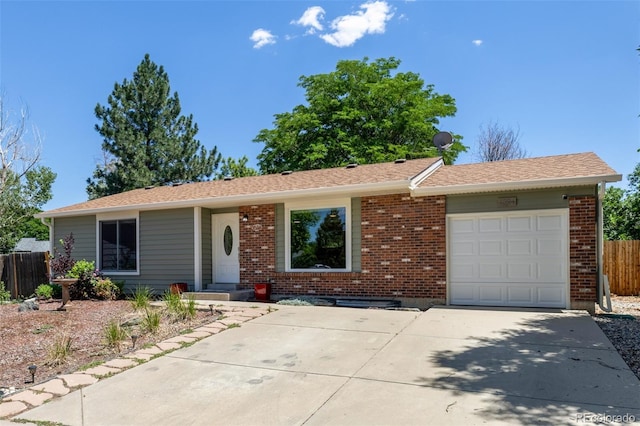1394 S Zeno St, Aurora, CO 80017 - single story home with concrete driveway, an attached garage, and brick siding