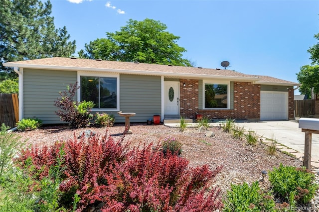 1394 S Zeno St, Aurora, CO 80017 - single story home with an attached garage, concrete driveway, and brick siding