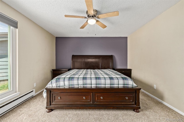 1394 S Zeno St, Aurora, CO 80017 - bedroom with a baseboard heating unit, a textured ceiling, light colored carpet, and a ceiling fan