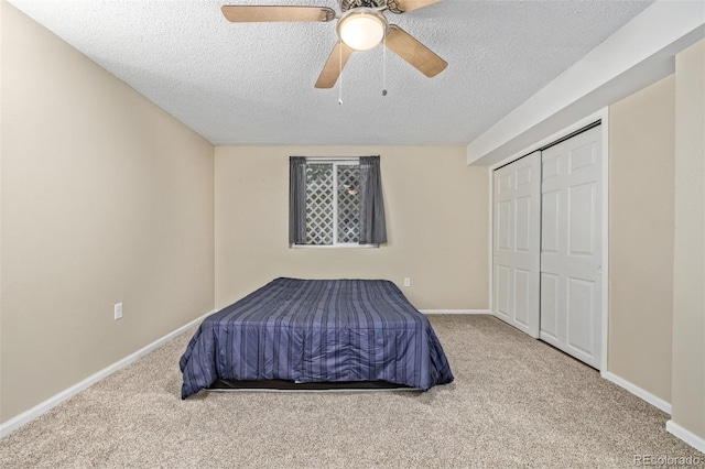 1394 S Zeno St, Aurora, CO 80017 - carpeted bedroom with a textured ceiling, a ceiling fan, and a closet