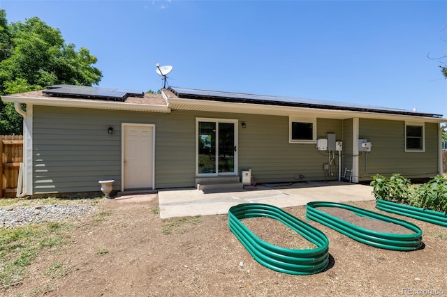 1394 S Zeno St, Aurora, CO 80017 - back of house with roof mounted solar panels and a patio area