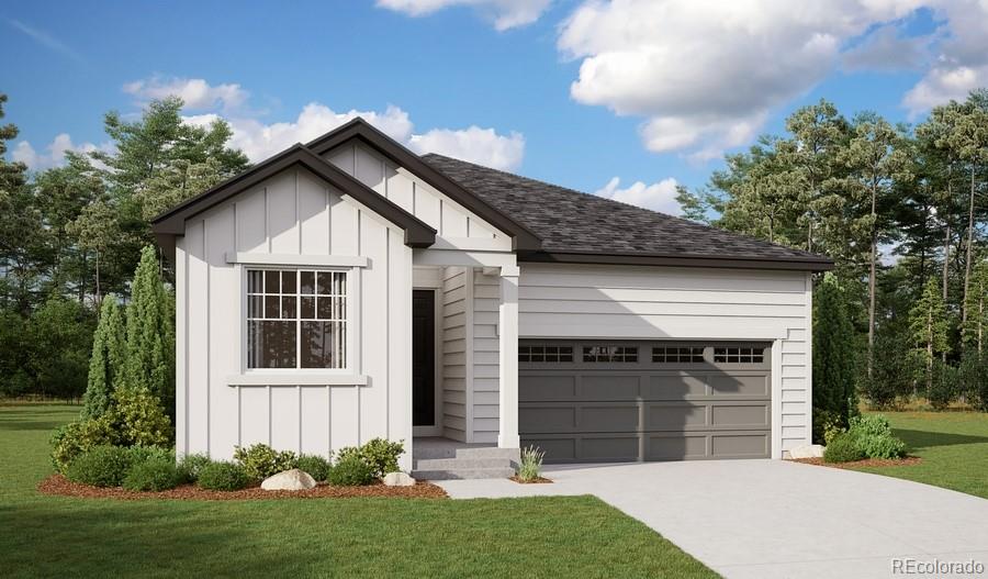 view of front of house with a garage and a front yard