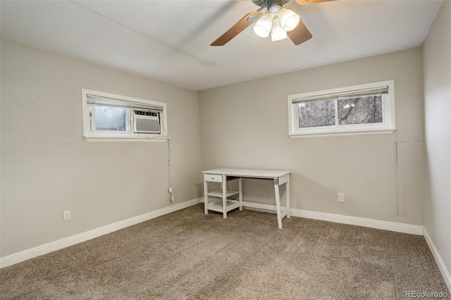 unfurnished office featuring ceiling fan and carpet floors