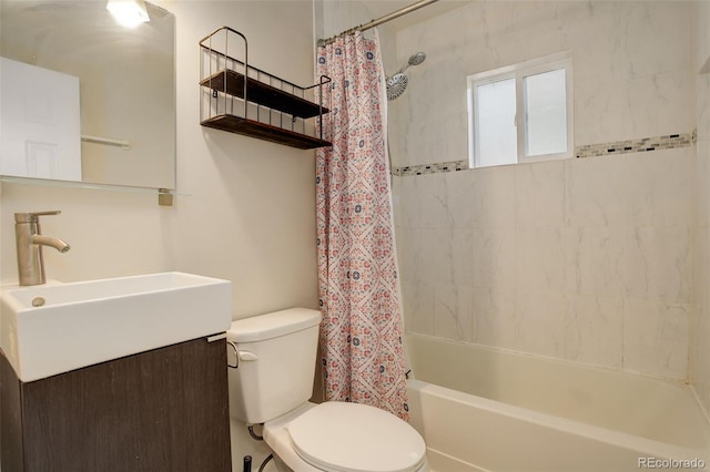 full bathroom featuring vanity, shower / tub combo, and toilet