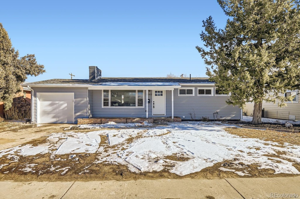 single story home featuring a garage