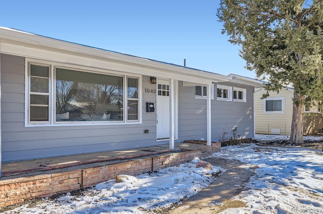 ranch-style house featuring covered porch