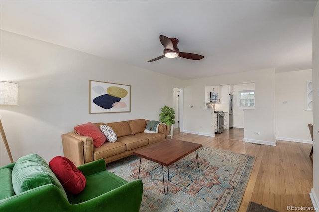 860 Magnolia St, Denver, CO 80220 - living room featuring light wood finished floors and a ceiling fan