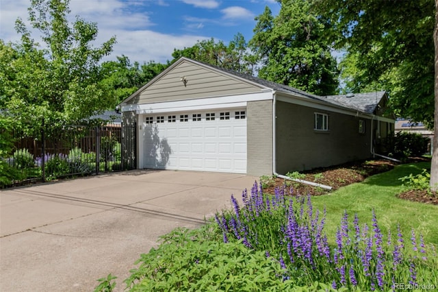 860 Magnolia St, Denver, CO 80220 - view of side of home featuring brick siding and an attached garage