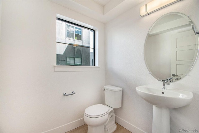 2032 S Holly St Unit 3, Denver, CO 80222 - bathroom featuring baseboards and toilet