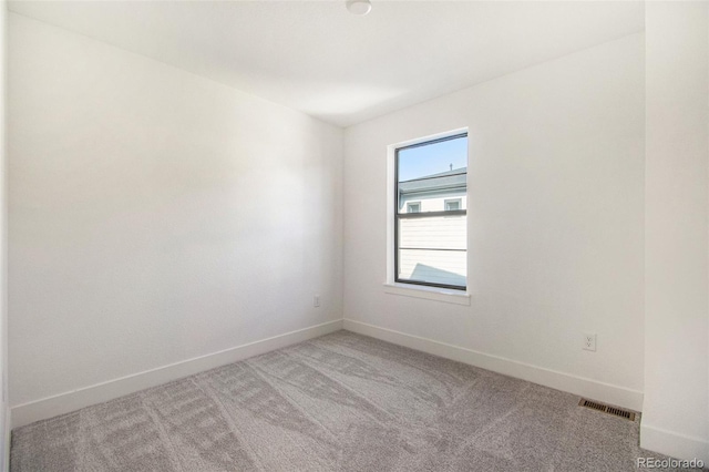2032 S Holly St Unit 3, Denver, CO 80222 - spare room with baseboards and light colored carpet