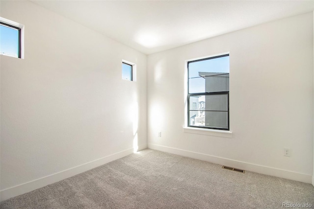 2032 S Holly St Unit 3, Denver, CO 80222 - spare room featuring carpet flooring and baseboards