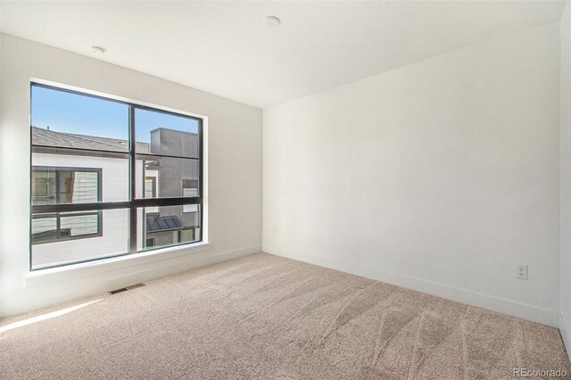 2032 S Holly St Unit 3, Denver, CO 80222 - unfurnished room featuring carpet and baseboards