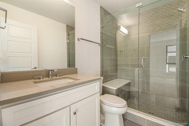 2032 S Holly St Unit 3, Denver, CO 80222 - bathroom with vanity, a shower stall, and tile patterned flooring