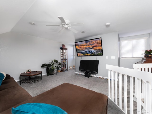 carpeted living room with lofted ceiling