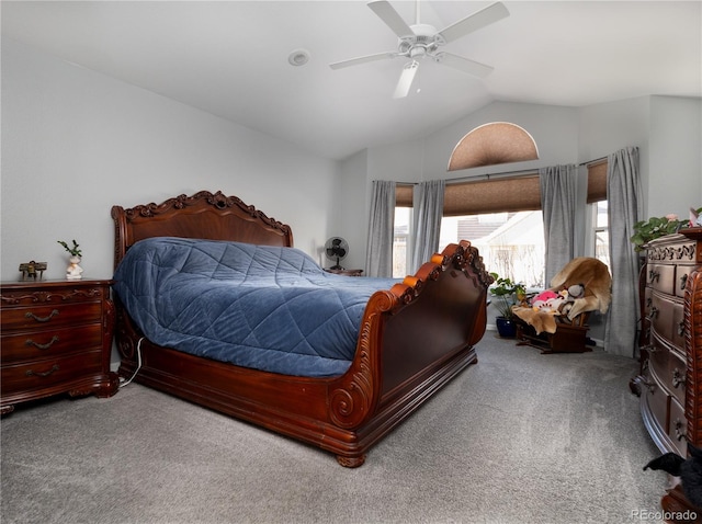 carpeted bedroom with vaulted ceiling and ceiling fan