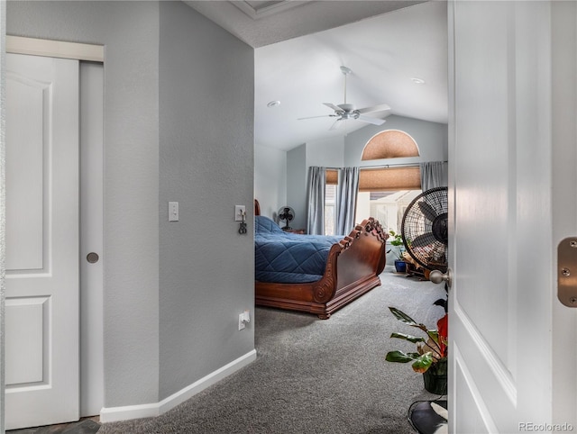 bedroom featuring lofted ceiling, carpet floors, and ceiling fan