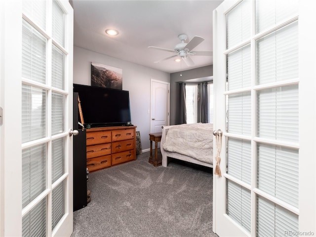 bedroom with ceiling fan and carpet flooring