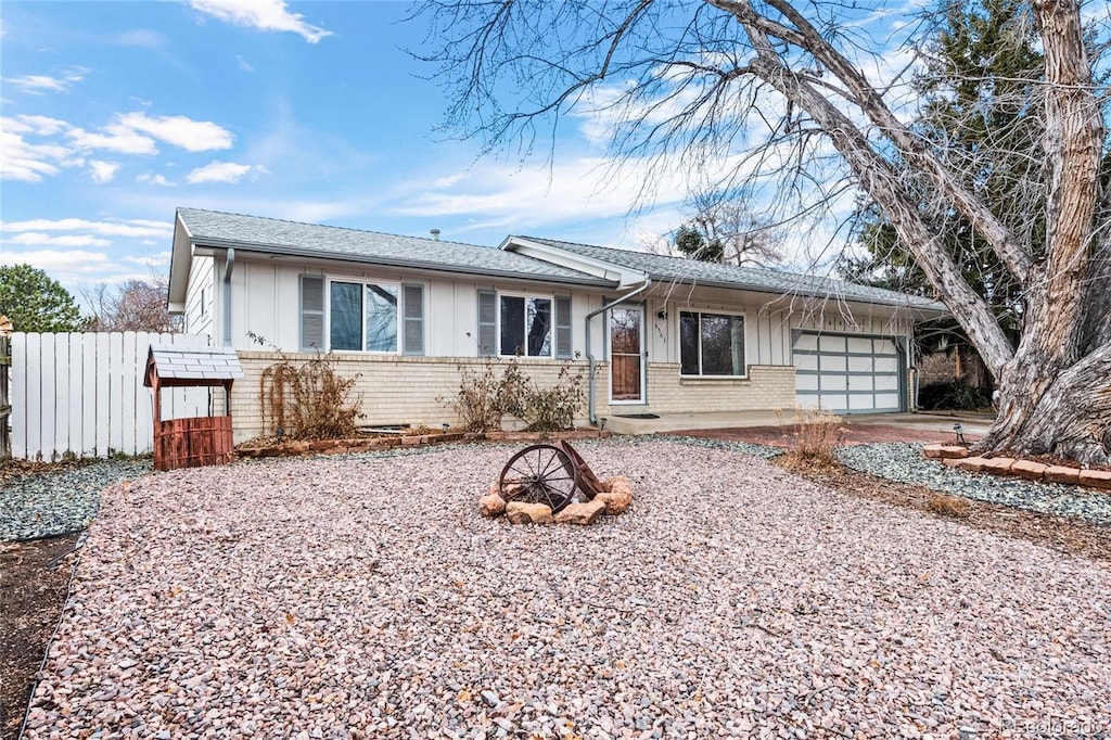 single story home featuring a garage