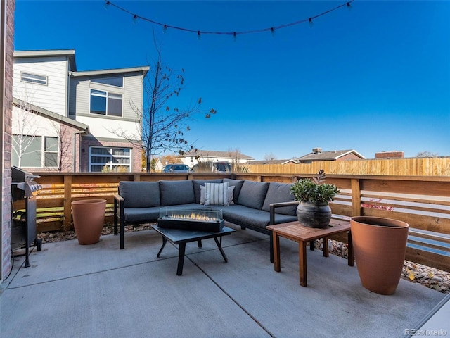 view of patio with a grill, fence, and outdoor lounge area