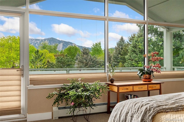 831 Crescent Dr, Boulder, CO 80303 - bedroom with baseboard heating, carpet floors, a mountain view, and multiple windows