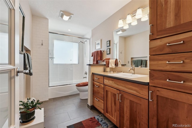 831 Crescent Dr, Boulder, CO 80303 - bathroom featuring tile patterned flooring, vanity, toilet, and enclosed tub / shower combo