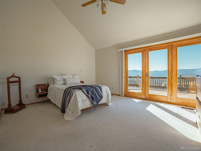 carpeted bedroom featuring ceiling fan, a mountain view, high vaulted ceiling, and access to outside