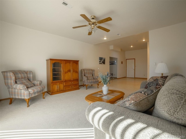 living room with ceiling fan and light colored carpet